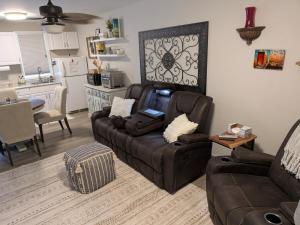 a living room with a couch and a kitchen at Cozy Hideaway guest suite in Midlothian +16 photos
