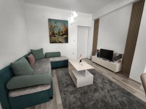 a living room with a couch and a table at N&L apartments in Strumica