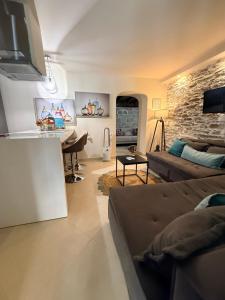 a living room with a couch and a table at Sea La Vie in Keramídhion