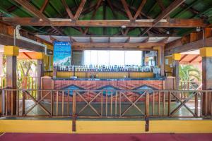 a bar in a building with a wooden ceiling at Decameron San Luis - All Inclusive in San Andrés