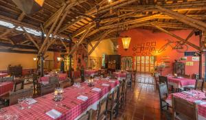 a restaurant with pink tables and chairs in a room at Decameron Panaca - All Inclusive in Quimbaya