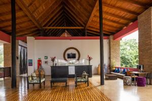 a living room with a couch and a table at Decameron Barú - All Inclusive in Playa Blanca +24 photos