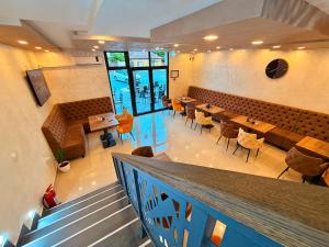 an overhead view of a restaurant with tables and chairs at Family Inn in Subotica