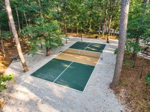 an overhead view of a tennis court with trees at Forest Springs Resort in Eureka Springs