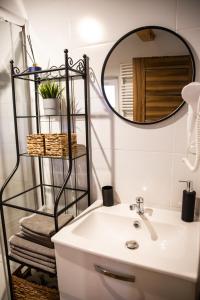 a bathroom with a sink and a mirror at Siedlisko pod lipą in Józefów +52 photos
