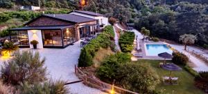 an aerial view of a house with a swimming pool at Villa Regadio in Covilhã