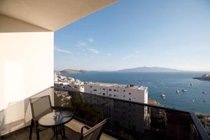 a balcony with a view of the ocean and buildings at Oleva Sea View Suites in Sarandë