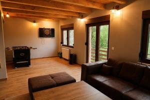 a living room with a couch and a table at Srce Baranje in Podolje