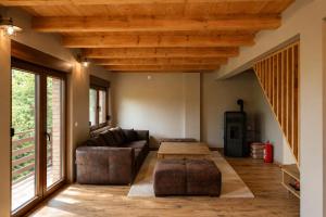 a living room with a couch and a table at Srce Baranje in Podolje