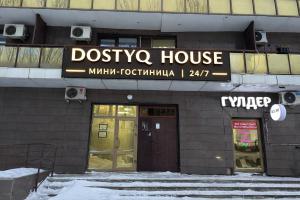 a dotsko house with a sign above its doors at Dostyq in Astana