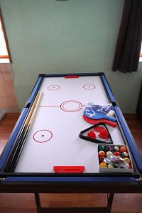 a ping pong table with chopsticks and balls on it at Moderne offene Wohnung in Bad Sulza