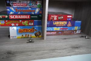 a stack of cereal boxes sitting on a shelf at Moderne offene Wohnung in Bad Sulza