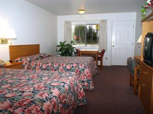 Ein Bett oder Betten in einem Zimmer der Unterkunft Dude & Roundup