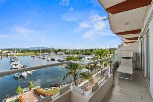 a balcony with a view of a marina at Marina Banderas Suites Hotel Boutique in Nuevo Vallarta