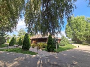 a house on the side of a road at Rancho Otel Almaty in Qaskeleng