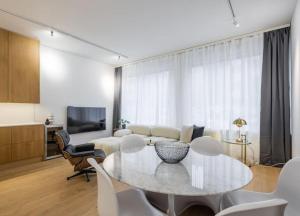 a living room with a table and a couch at City Choice Apartment in Helsinki +13 photos