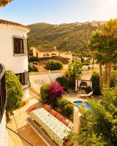 an aerial view of a house with a swimming pool at Casa Toucan Moraira in Benitachell