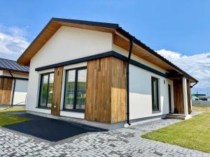 a small house with a lot of windows at Sky Residence House 5 in Cluj-Napoca