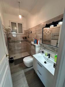 a bathroom with a toilet and a sink at Charmante villa in Hyères +22 photos