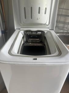 a washer with its door open in a refrigerator at Turifoss Camping Tent pitch in Svedjan