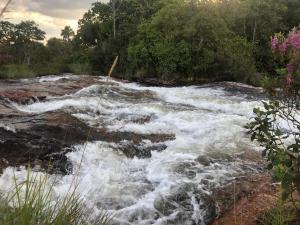 a river with white rapids on the rocks at Hostel Itapiru in Mateiros