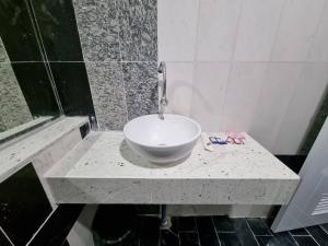a bathroom with a bowl sink on a counter at The loft 2 in Ban Khlong Khwang Klang