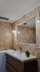 a bathroom with a sink and a mirror at Platanos View in Plátanos +72 photos