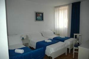 Voodi või voodid majutusasutuse Albergo Dei 10 Colori toas
