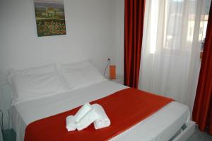 Voodi või voodid majutusasutuse Albergo Dei 10 Colori toas