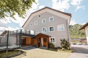 a large house with a glass facade at Haus Auszeit in Rauris