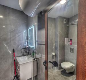 a bathroom with a toilet and a sink at DN Kiten in Kiten