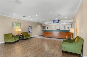 a waiting room at a hospital with chairs and a waiting station at Ocean Creek Resort in Myrtle Beach