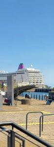 a bridge with a cruise ship in the water at Quayside Waters in Dundee