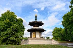 a pagoda with a cross on top of it at Property Reality in London