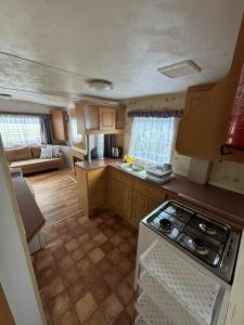 an overhead view of a kitchen with a stove at Noclegi u Kostka Sarbinowo in Sarbinowo +12 photos