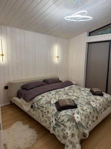 a bedroom with a large bed in a room at My Dream in Antalovtsi