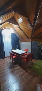 a room with a table and four chairs in a tent at Captain in Ureki