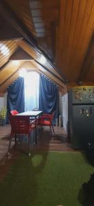 a tent with a table and chairs and a stove at Captain in Ureki