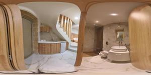 a bathroom with a toilet and a sink and a staircase at Faros Elafonisi in Elafonisi