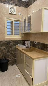 a kitchen with a counter and a sink in it at العاصفة in Khamis Mushayt +30 photos