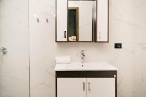a bathroom with a sink and a shower at Velmare Inn in Ulcinj +90 photos
