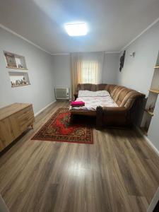 a living room with a couch and a rug at Садиба у Оксани in Verkhneye Sinevidnoye