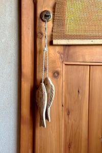 ajar door knob of a wooden door with ajar door at Tillka - Casas de Montaña in Villa La Angostura