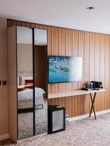 a bedroom with a bed and a tv on a wall at Nevv City Hotel in Istanbul +17 photos