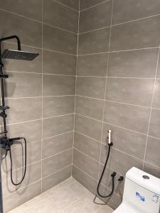 a bathroom with a shower with a toilet at شاليهات سمو بارك 2 in Taif