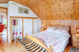 a bedroom with a bed and a wooden ceiling at 2 Bed in Cashel oc-i223 in Moyrus +21 photos