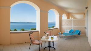 a room with a view of the ocean at Hotel Kvarner Palace in Crikvenica