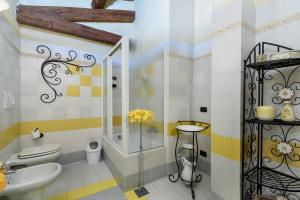 a bathroom with a toilet and a sink at Casa Buonumore in Gaiola +12 photos