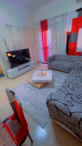 a living room with a couch and a table at Kaila 1 in Keur Massar