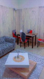 a living room with a couch and a table at Kaila 1 in Keur Massar